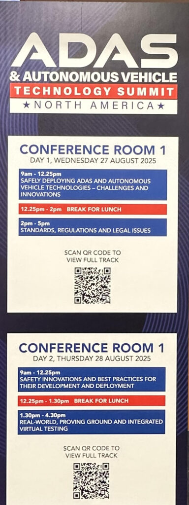 Conference agenda sign for the ADAS & Autonomous Vehicle Technology Summit North America 2025, showing sessions on deploying ADAS technologies, standards and regulations, safety innovations, and real-world testing across August 27–28, 2025.