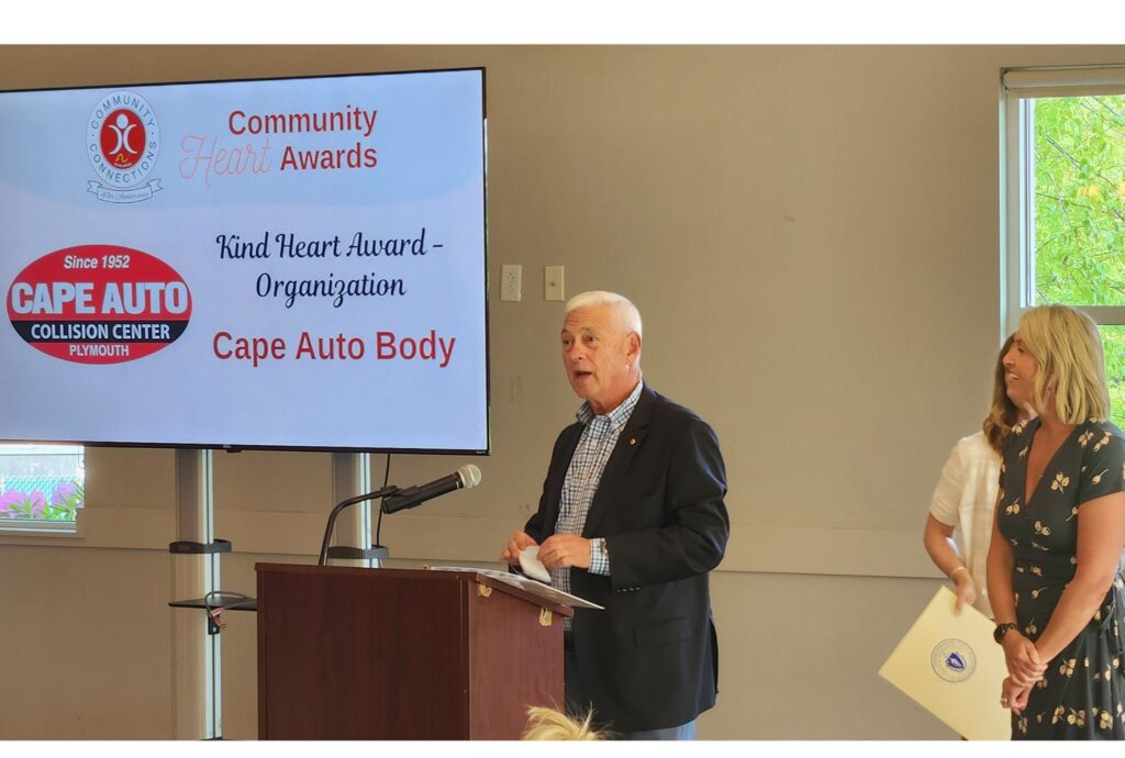 Cape Auto owner Dave Gallerani accepts Community Connections’ “Kind Heart Award,” underscoring the shop’s people-first approach to EV safety and training.